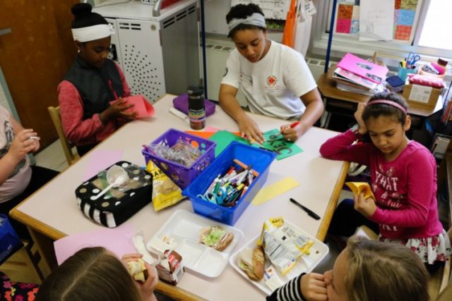 City Year AmeriCorps member works with students