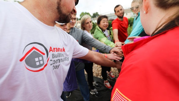 A group of volunteers at a service day doing a spirit break