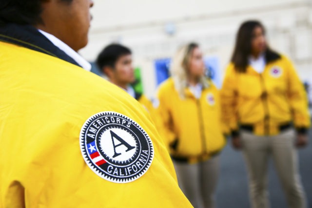 Close up of the AmeriCorps California patch on a yellow City Year jacket