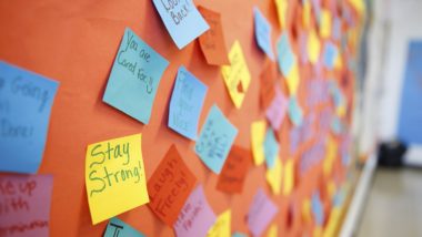 Bulletin board with inspirational and positive notes.