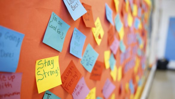 Bulletin board with inspirational and positive notes.