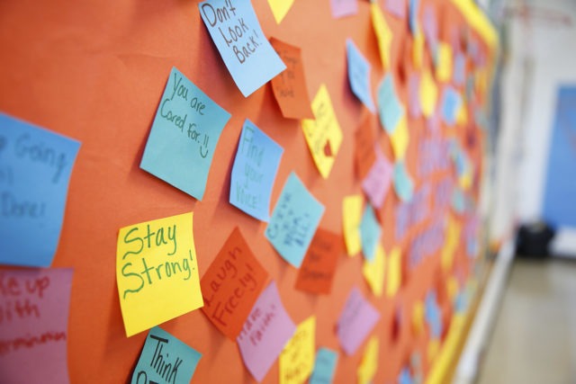 Bulletin board with inspirational and positive notes.