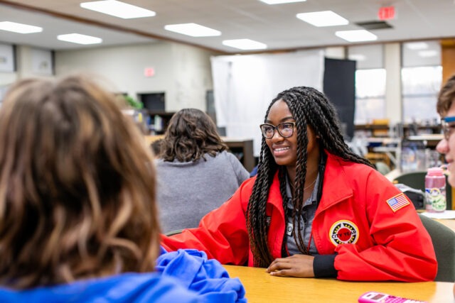 City Year In School Service red jacket