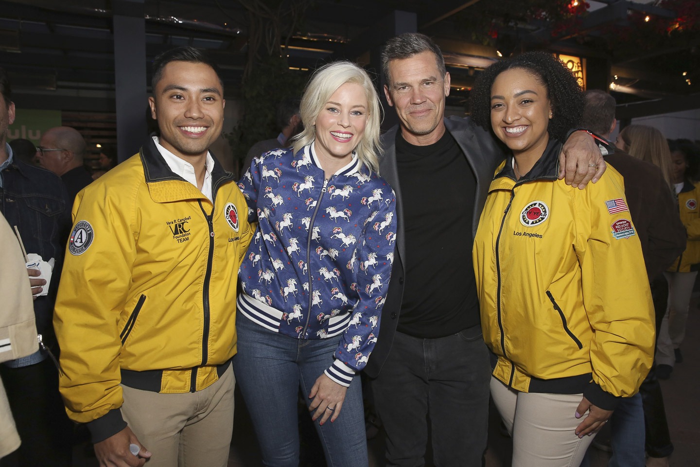 2 AmeriCorps members pose with Elizabeth Banks and Josh Brolan