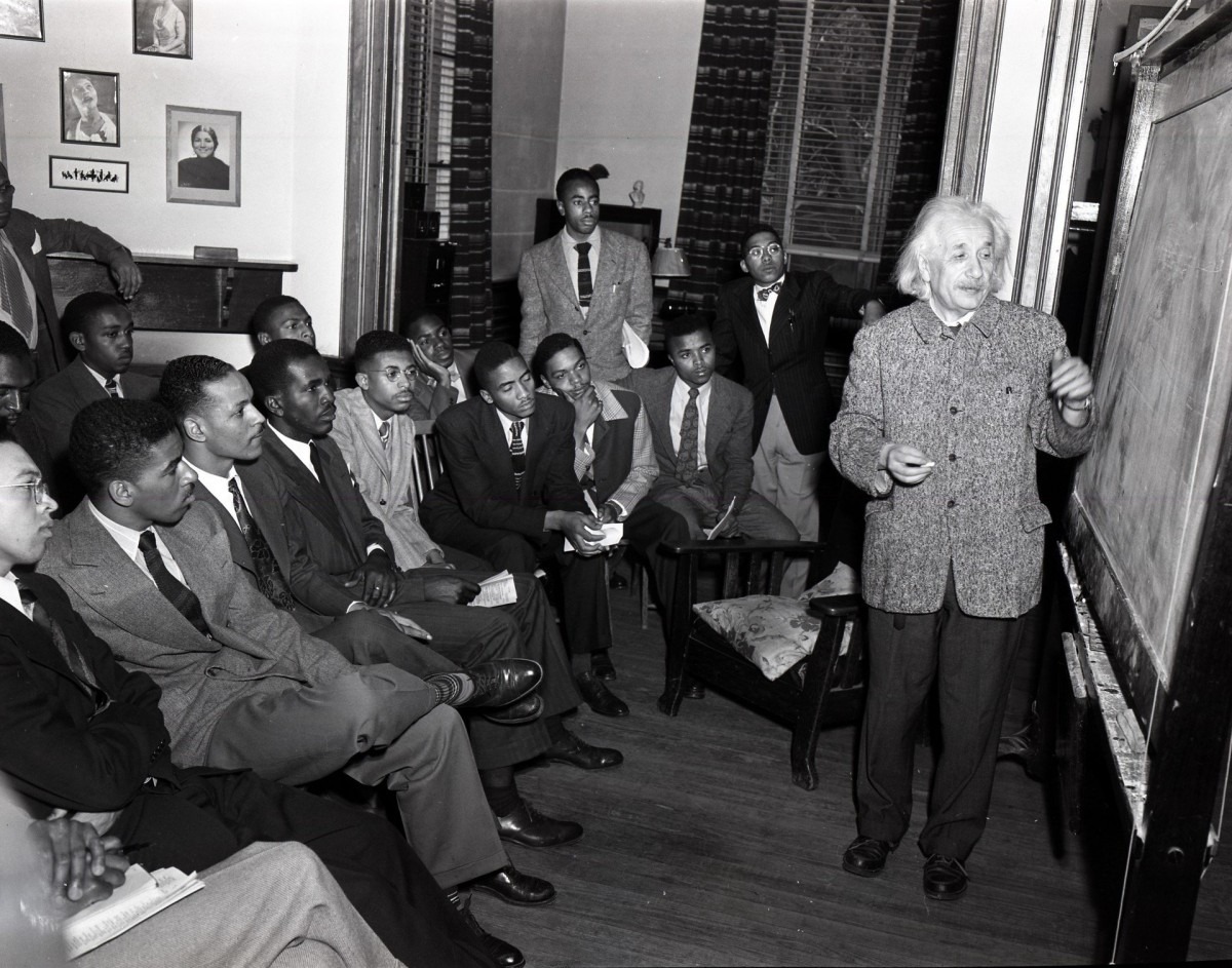 Albert Einstein stands at a chalkboard at Lincoln University. A class of Black men watch him lecture.