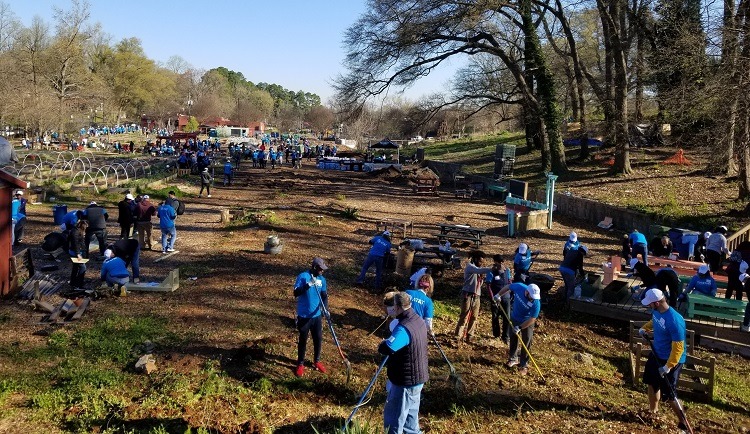 AT&T volunteers garden and landscape on the service day at the Truly Living Well Center. 