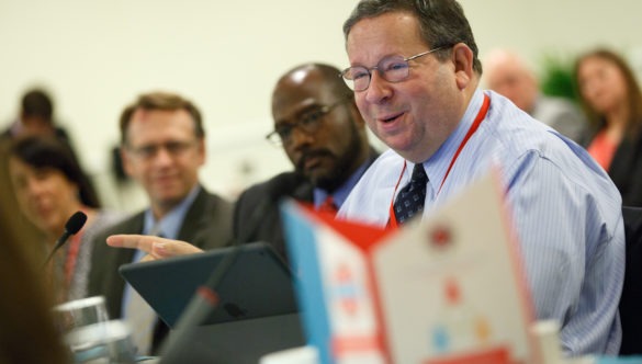 David L. Chohen speaks in a meeting at the City Year Investor's Summit