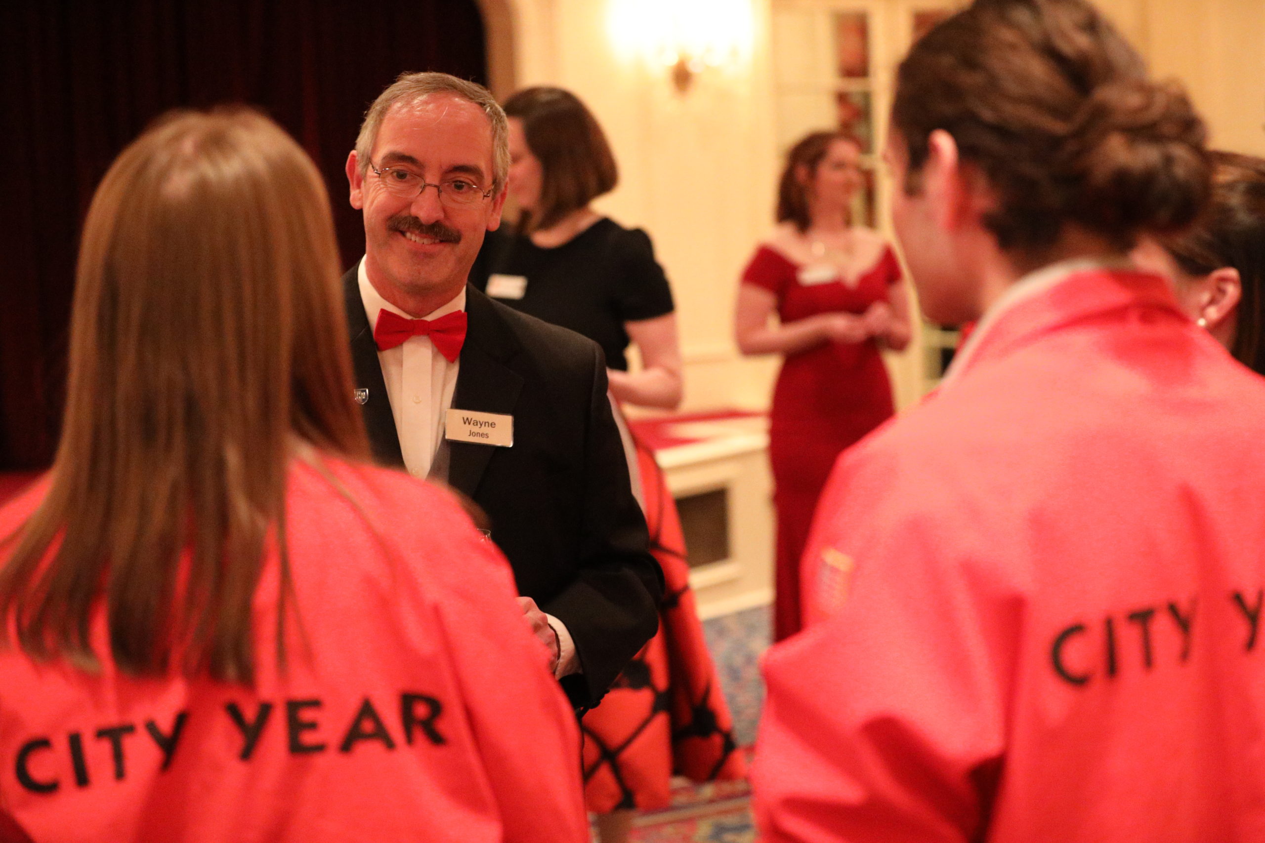 AmeriCorps members mingle with guests