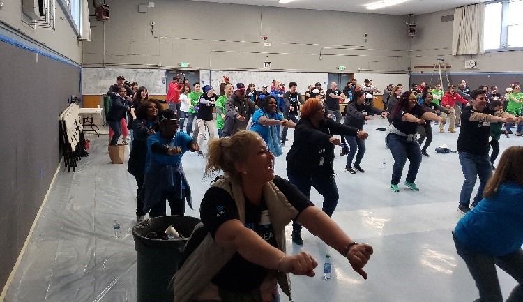 AT&T volunteers perform Foot Fires, generally known to be the finest PT move ever created by City Year.