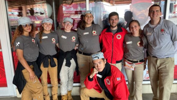 Team Care Force wearing their gray Service Reserves shirts with two Care Force staff members.