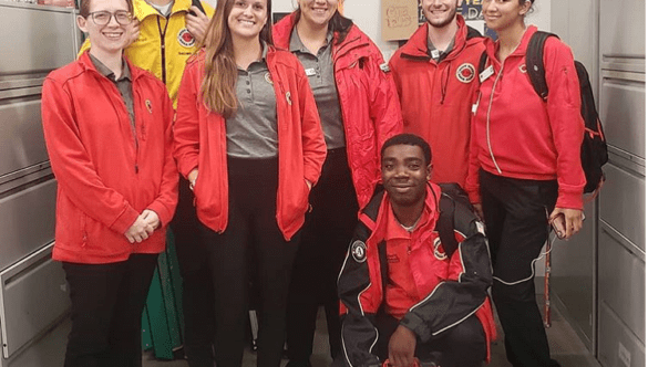 Team Care Force poses at City Year HQ with City Year jackets.