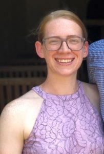 Headshot of Senior AmeriCorps Member Brittany Blackerby smiling in a purple dress.