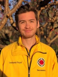 Headshot of Senior AmeriCorps Member Masaki Carty smiling in the yellow City Year jacket.