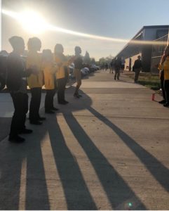 City Year AmeriCorps members powergreet students into school