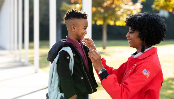 City Year AmeriCorps member with student