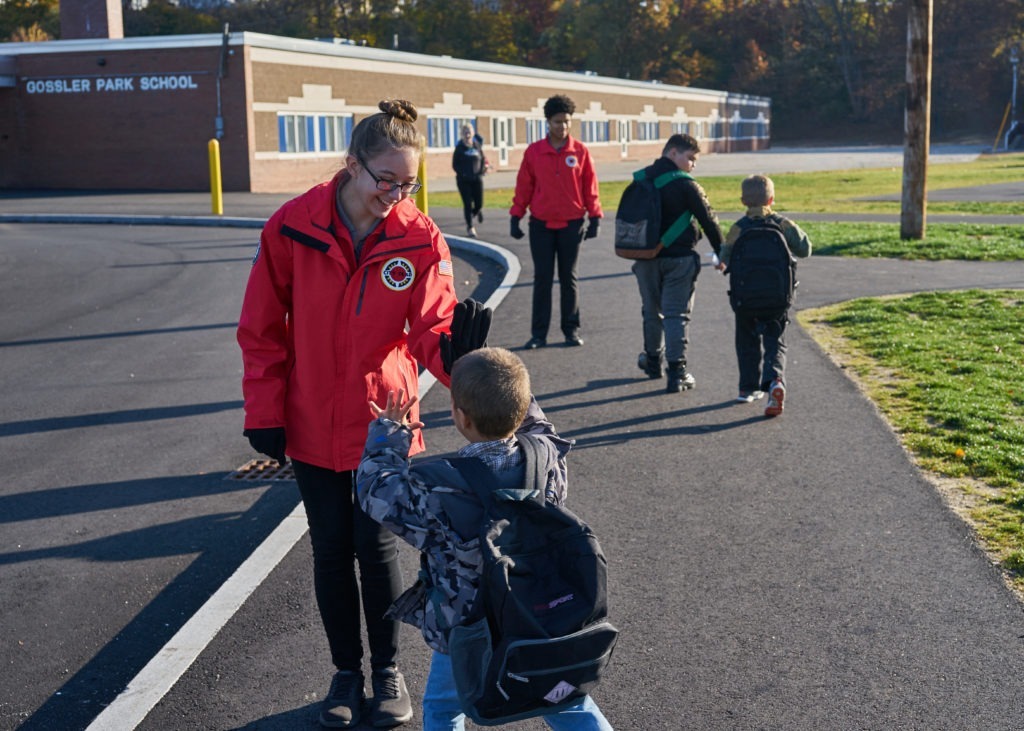 Shannon Luby greets students