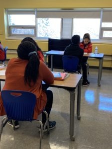 City Year AmeriCorps members working one-on-one with students