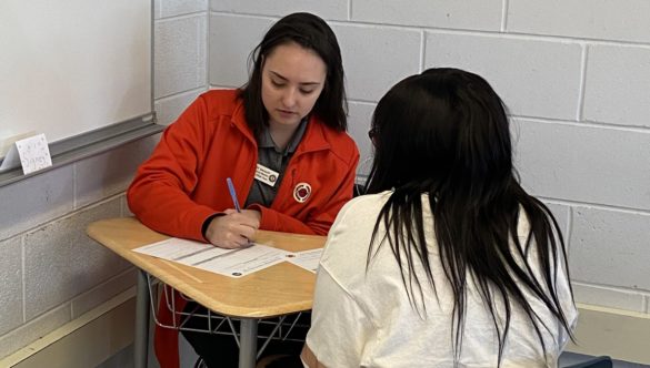City Year Milwaukee AmeriCorps member working one-one-one with a student.