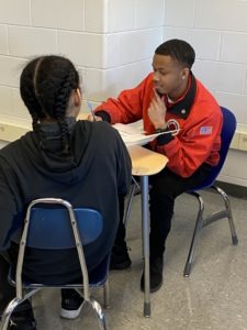 City Year AmeriCorps member working one-on-one with student.