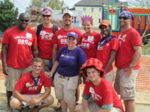 Care Force and Kaboom take a team photo together during a project.