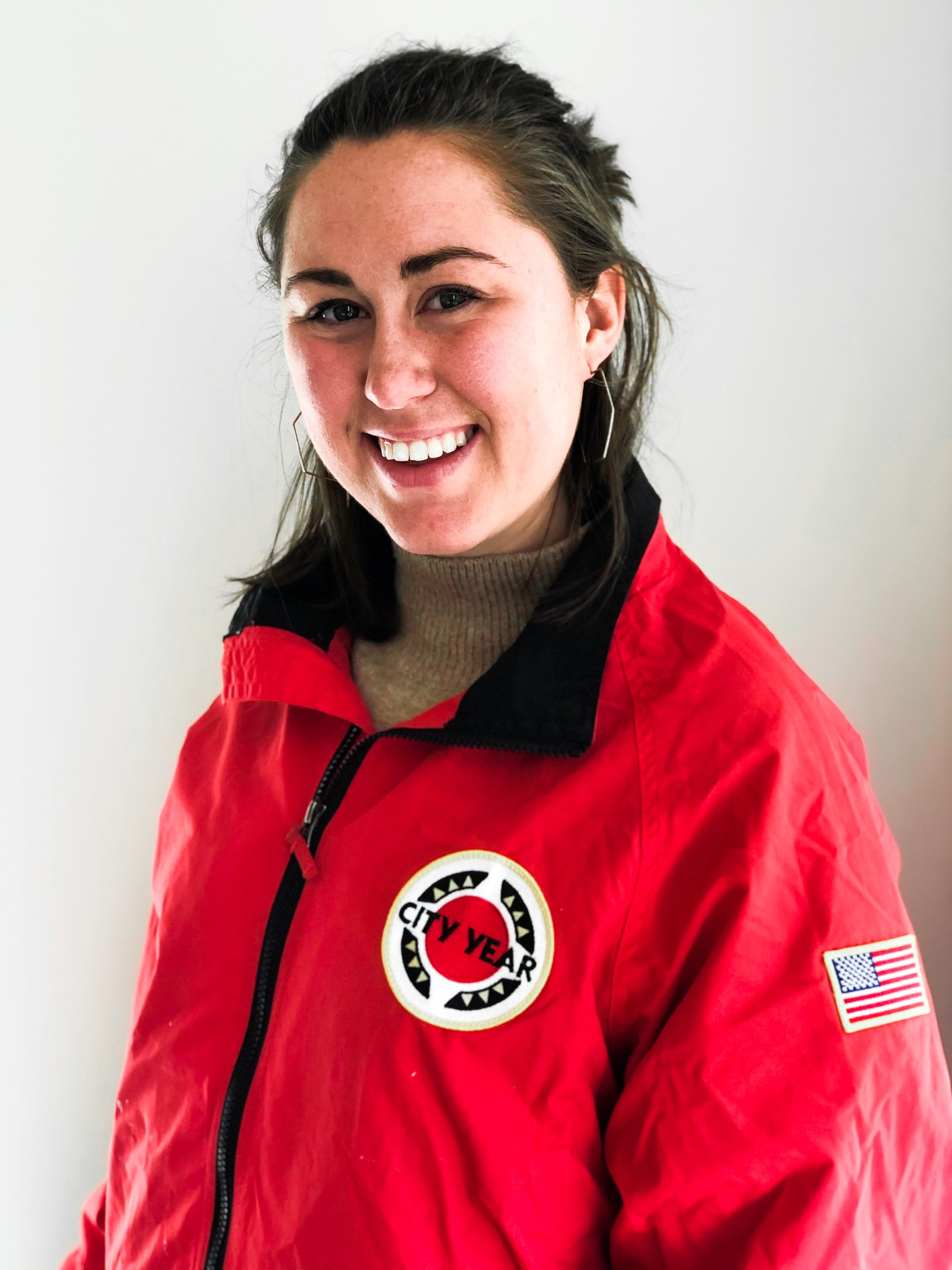 Ellie Carver in a CY red jacket