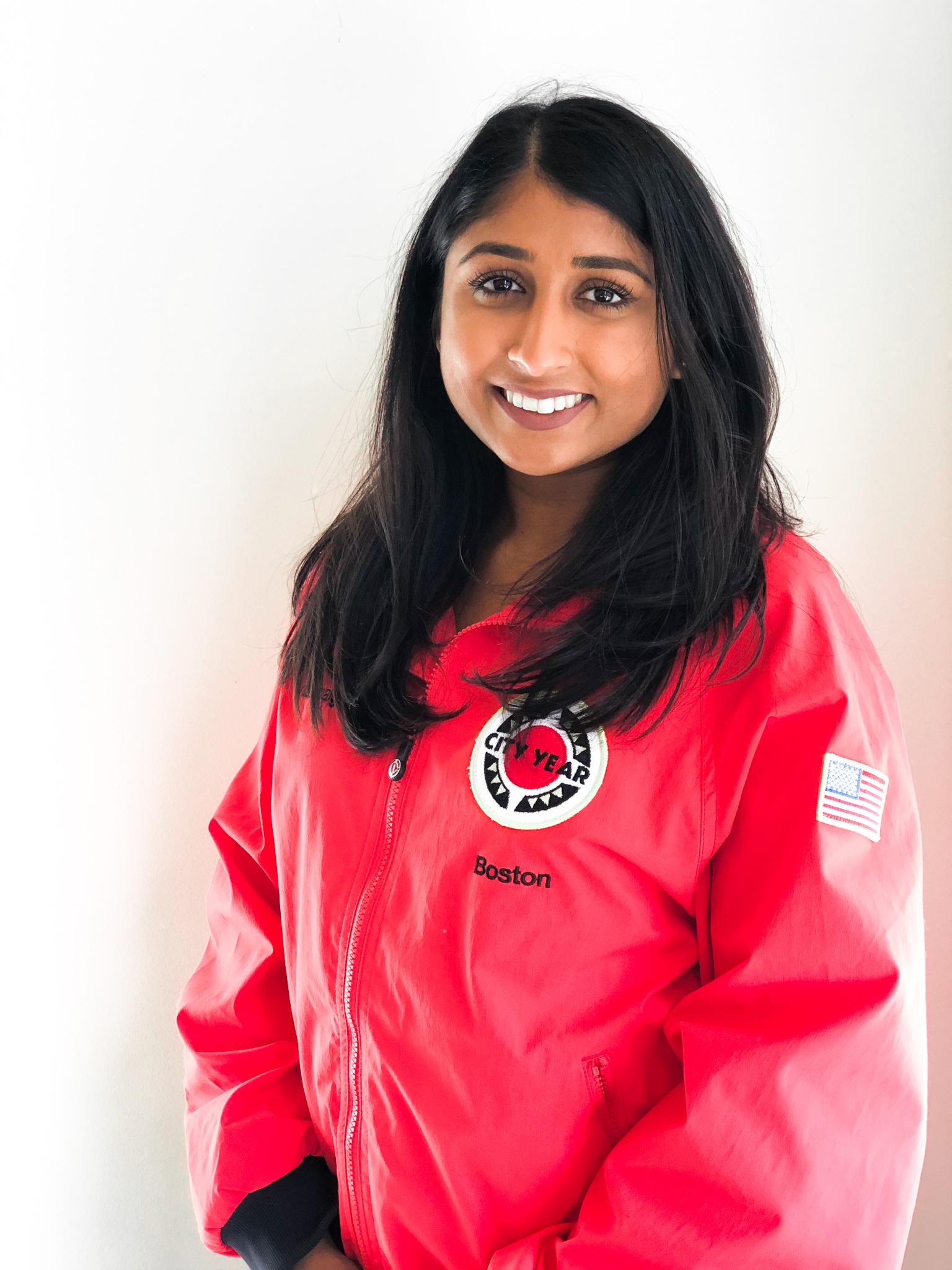 Kalpita Patel in a CY red jacket