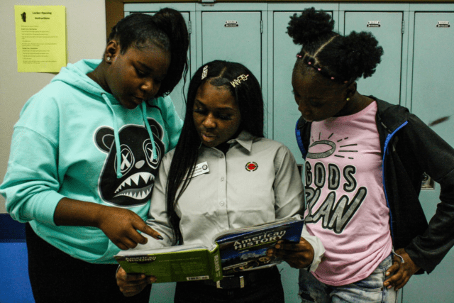 City Year Milwaukee AmeriCorps member tutoring students