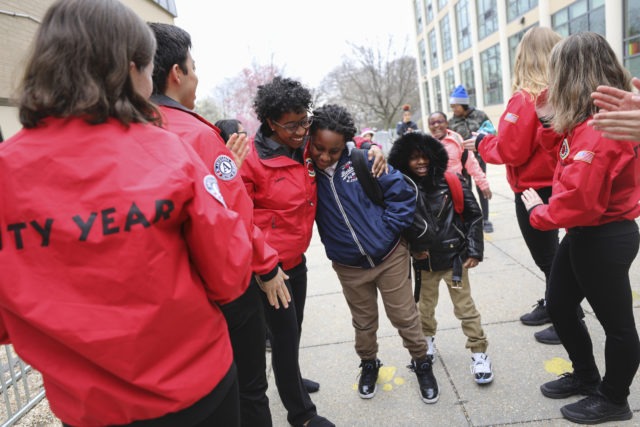City Year Washington, D.C. AmeriCorps serving as student success coaches morning greeting with students
