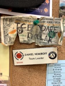 This is the TCF Dare Dollar. Dare Dollar was a game Dan’s team played all year - whoever was in possession of the DD could propose a dare to the rest of the team, and whoever completed the dare, got the dollar.