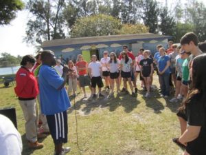 Volunteers in Miami form a community huddle to get inspiration, information and direction for a powerful day of service.