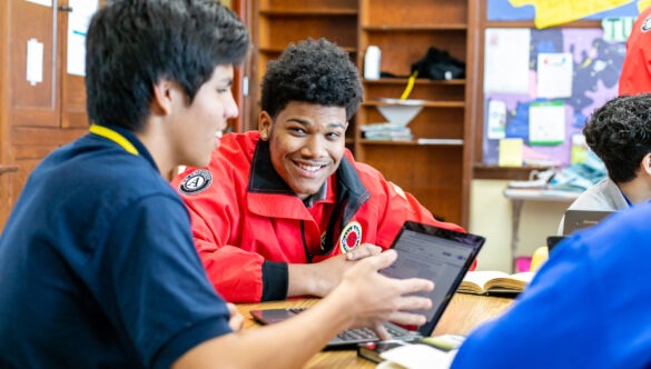 City Year AmeriCorps member tutors and mentors students