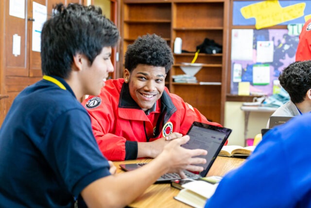 City Year AmeriCorps member tutors and mentors students