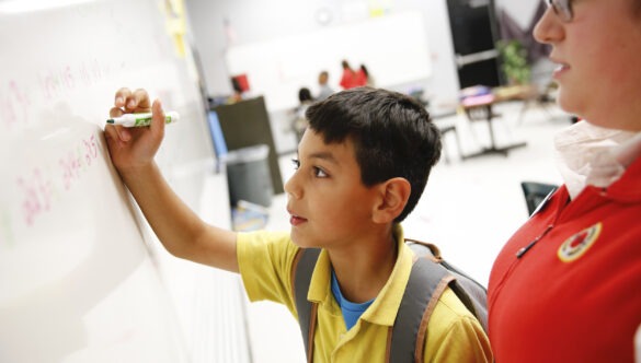 City Year AmeriCorps member promoting student success through social emotional learning