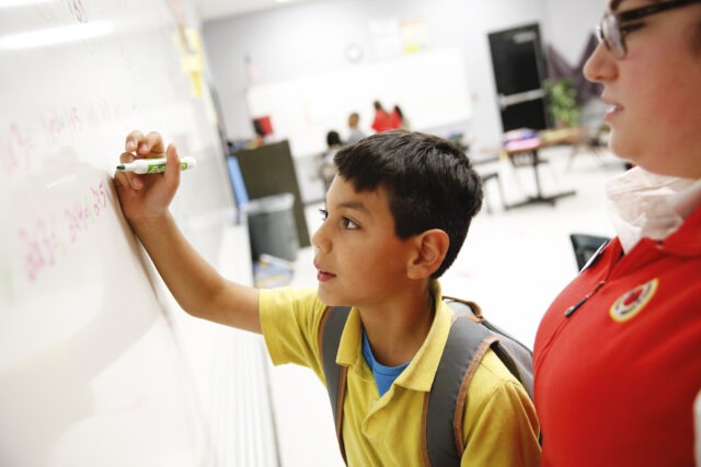 City Year AmeriCorps member promoting student success through social emotional learning