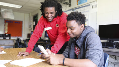 City Year AmeriCorps member tutors student