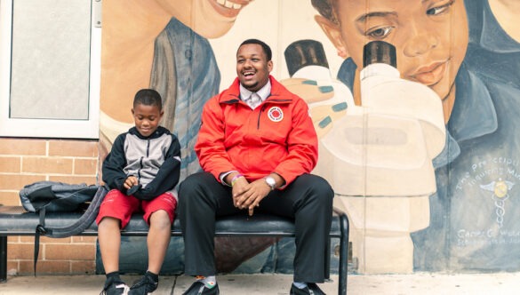 AmeriCorps member in Jacksonville, Florida talking with a student.