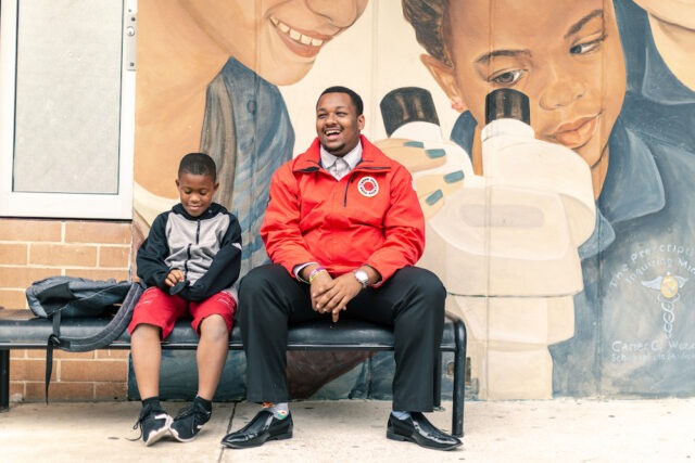 AmeriCorps member in Jacksonville, Florida talking with a student. 