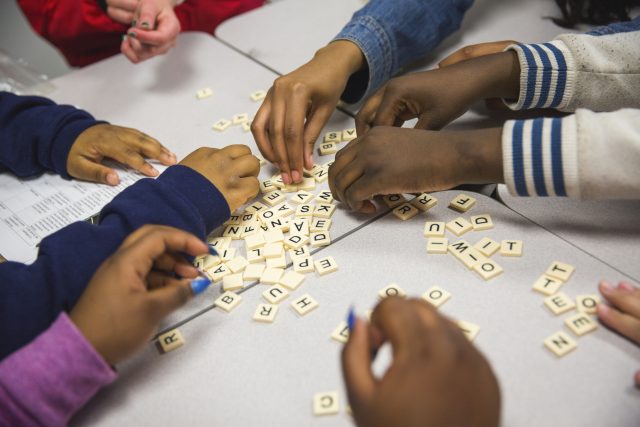 City Year member and students playing word games