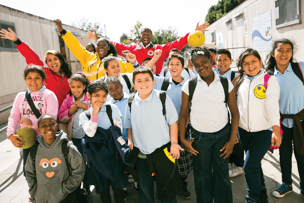 City Year AmeriCorps members with students at school
