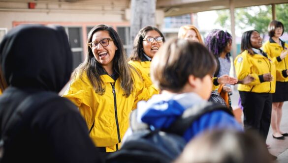 City Year AmeriCorps in school service yellow jacket