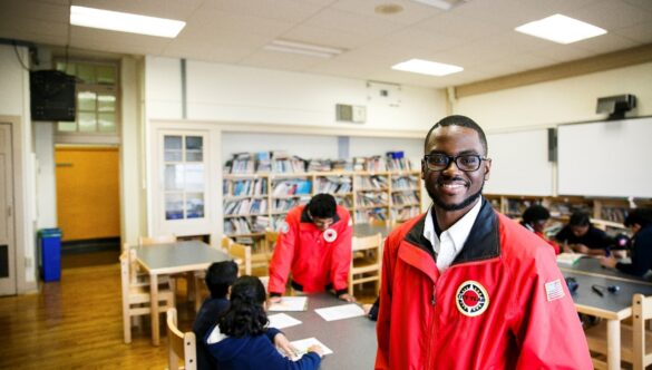 City Year AmeriCorps alum in school