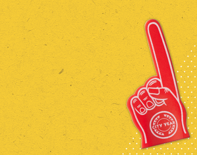 A red foam finger with the City Year logo sits on a yellow background.