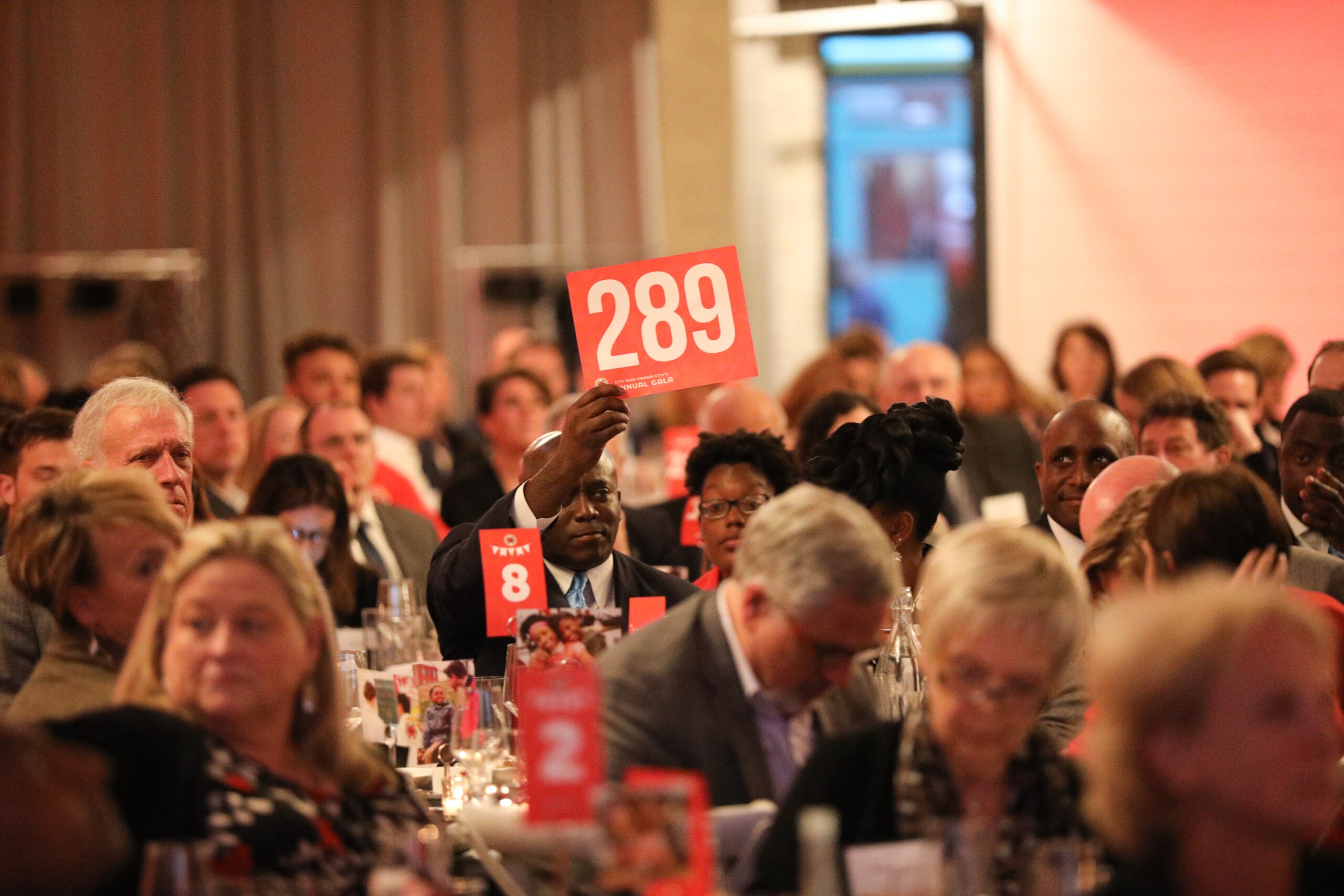 Guests participating in an auction at CY Kansas City's First Annual Gala