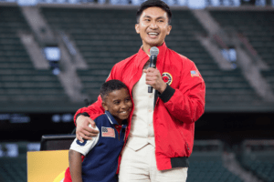 City Year Seattle AmeriCorps member hugs a student at the 2018 Ripples of Hope Gala