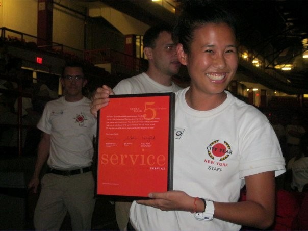 City Year alum holding the level five leadership award