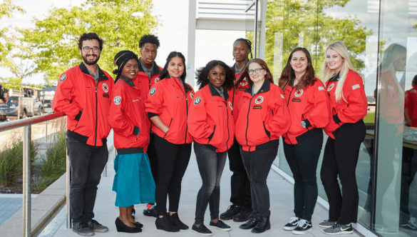 nine City Year Milwaukee AmeriCorps members pose for a photo