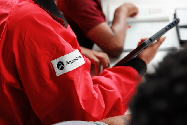 Close up of the AmeriCorps patch on the City Year red jacket