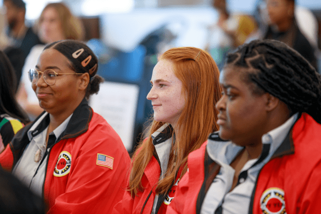Three City Year Baton Rouge AmeriCorps members in red jackets